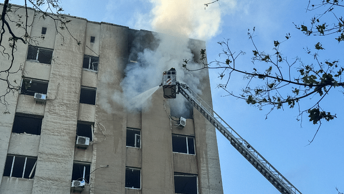 A firefighter works at the site of the building hit by a Russian drone strike, amid Russia's attack on Ukraine, Monday | Reuters