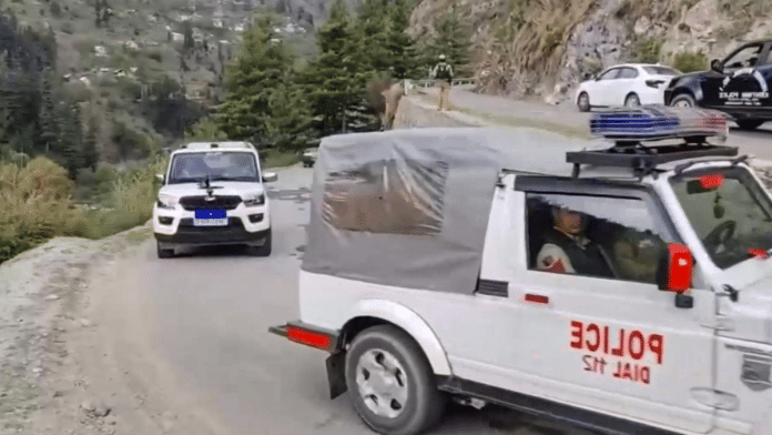 Police vehicles pass by amid a cordon and search operation after an encounter broke out between terrorists and security forces in the heavily forested Kanzal Mandu area of the Kuchal-Chatroo belt on Wednesday night, in Kishtwar district, Jammu and Kashmir, Thursday, July 3, 2025. | PTI