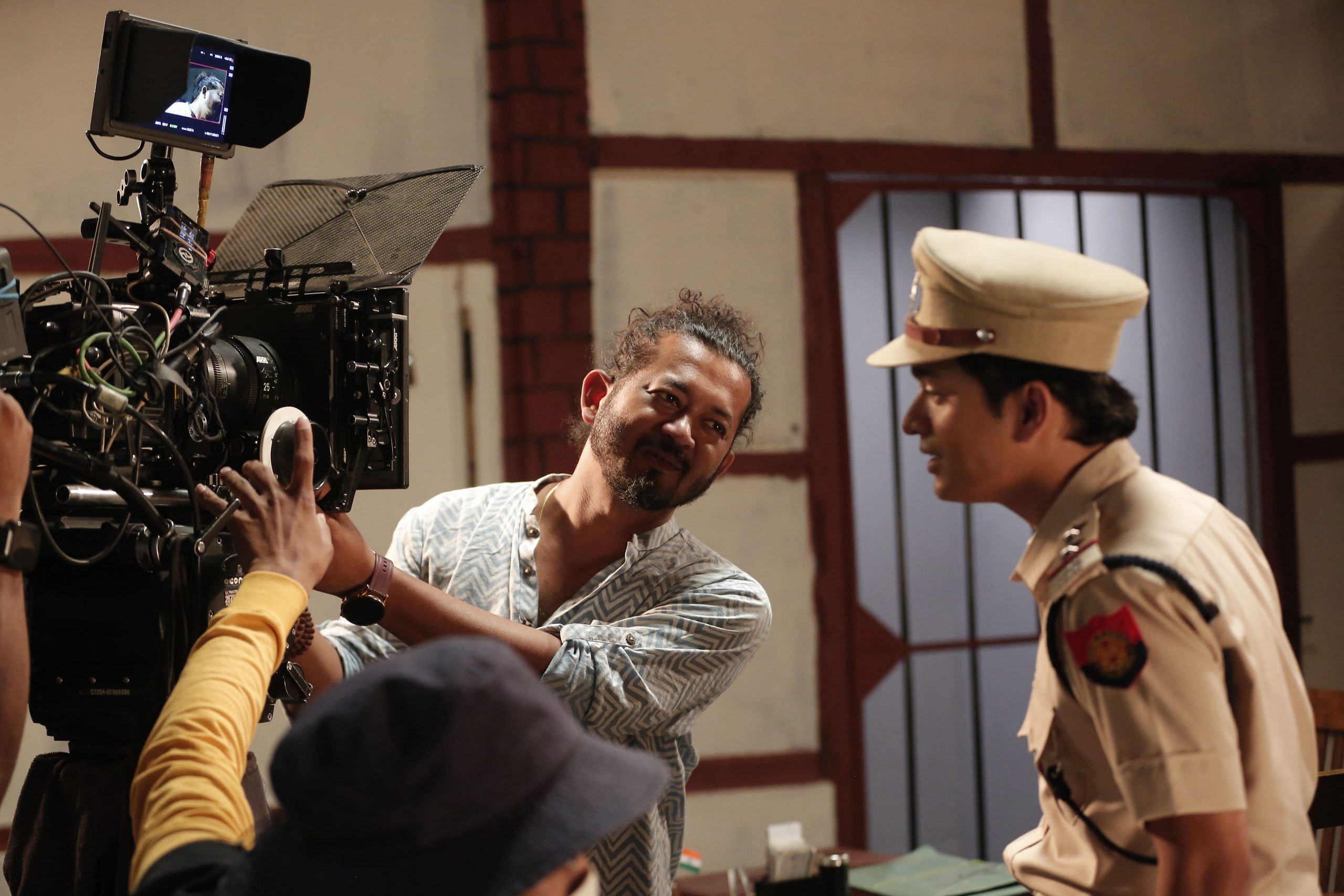 Director Sasanka Samir explaining a shot to his actors in Bhaimon Da