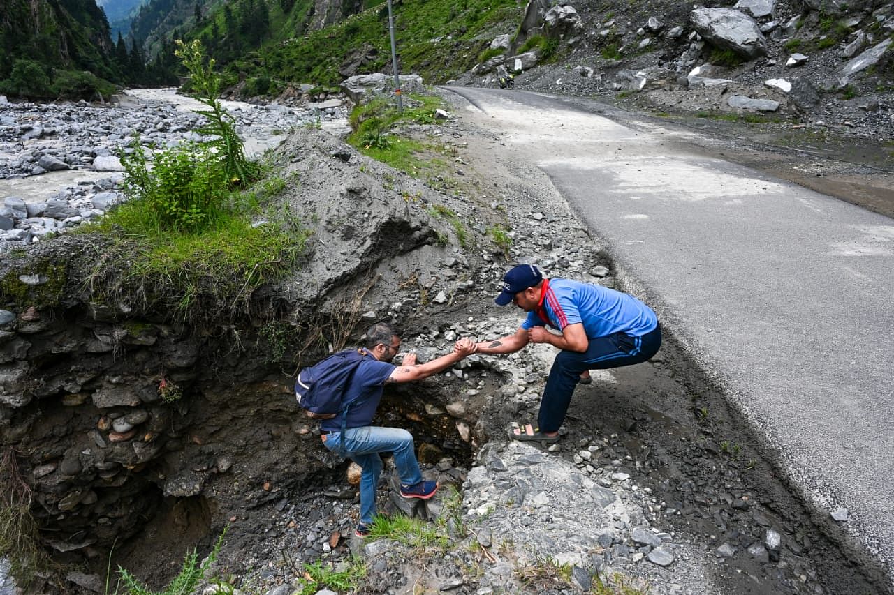 Uttarakhand police helping Udit to get on the road. Photo: Suraj Singh Bisht | The Print