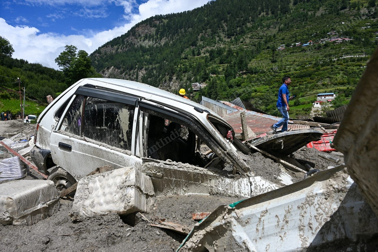 A car stuck in silt and debris | Suraj Singh Bisht | ThePrint