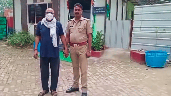 Greater Noida: Police personnel with father-in-law of Nikki, the 26-year-old woman who was allegedly set ablaze for dowry, after his arrest, in Greater Noida, Monday, 25 Aug 2025 | PTI