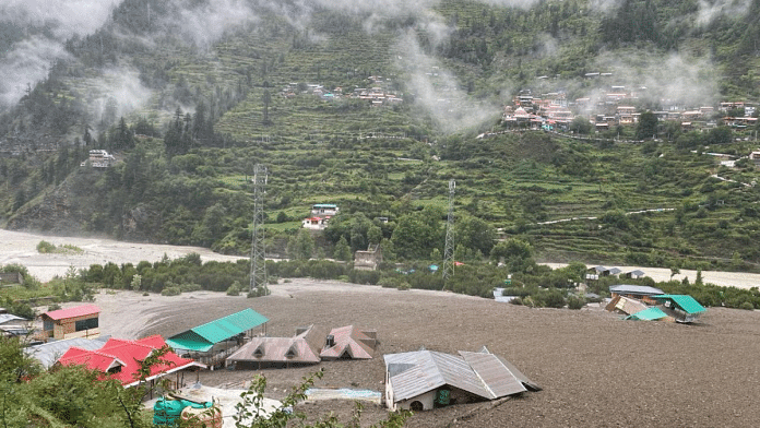 Houses are partially buried by a mudslide, amid flash floods, in Dharali, Uttarakhand, India, August 5, 2025 | Handout via Reuters