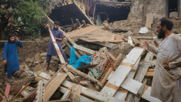 Afghan men search for their belongings amidst the rubble of a collapsed house after a deadly magnitude-6 earthquake that struck Afghanistan around midnight, in Dara Mazar, in Kunar province, Afghanistan, 1 September 2025. | Stringer | Reuters