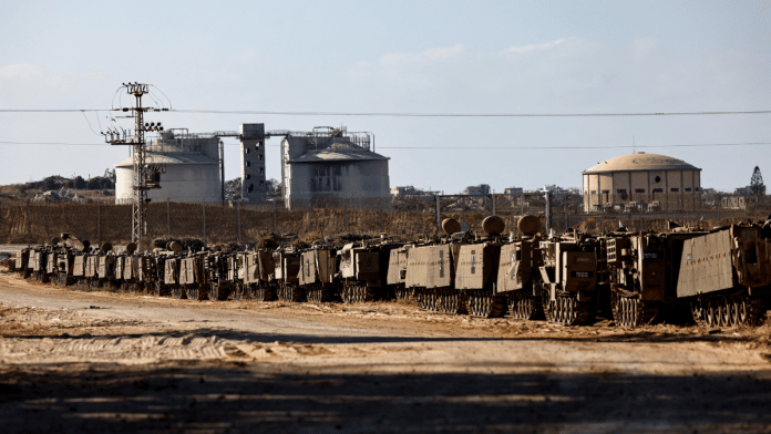 sraeli APCs stand aligned on the Israeli side of the border with Gaza, September 2, 2025 | Reuters
