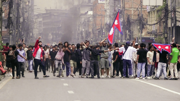 Protesters march during a protest against the government’s decision to block several social media platforms, in Kathmandu on Tuesday. | TV Today Nepal | Screengrab | ANI