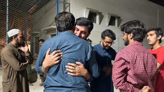 Men mourn the death of a relative, who was killed in a bomb blast at the public rally in Quetta, at hospital premises in Quetta, Pakistan on 2 September 2025. | Naseer Ahmed | Reuters