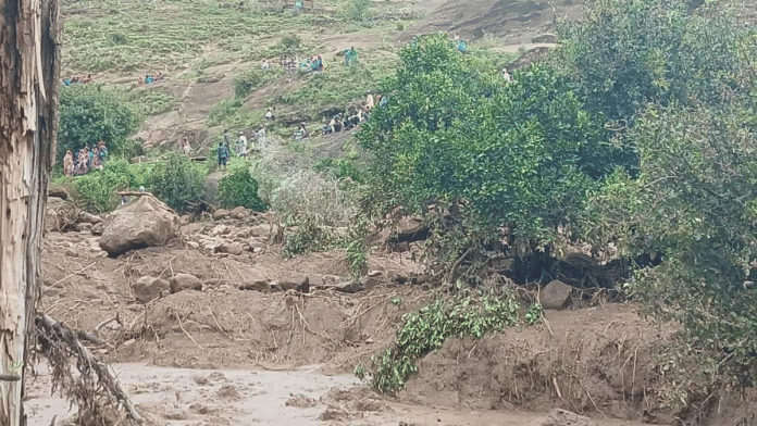 People gather at an area following a landslide that destroyed the Tersin village, in the Marra Mountains area of Sudan on 1 September 2025. | Sudan Liberation Movement/Army | Handout via Reuters