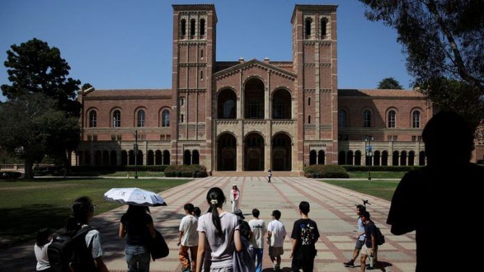 People walk through the campus of the University of California Los Angeles (UCLA) in Los Angeles on 11 August 2025. | Daniel Cole | Reuters