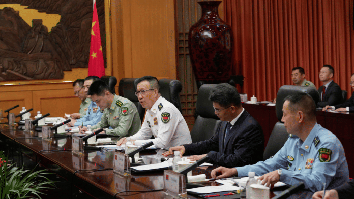 Chinese Defense Minister Dong Jun speaks with Rep. Adam Smith (D-WA), not pictured, who leads a bipartisan group of U.S. lawmakers for a meeting at the Ministry of Defense, Beijing on 22 September 2025. | Mahesh Kumar A. | Pool via Reuters