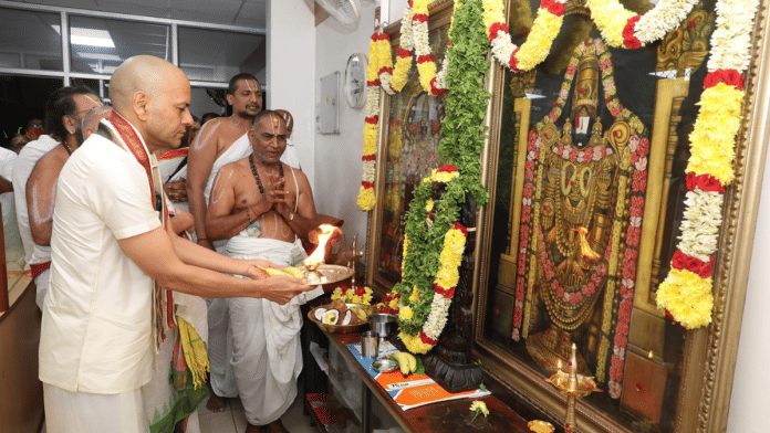 IAS officer Anil Kumar Singhal offers prayers at TTD head office in Tirupati on Thursday. | By special arrangement