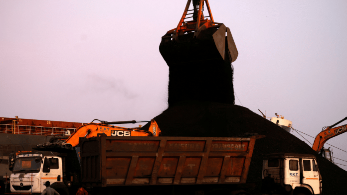 A crane unloads coal from a cargo ship at the Deendayal Port in Kandla, in the western state of Gujarat, India, September 25, 2024 | Reuters