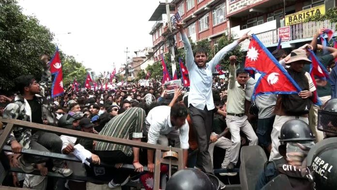 People stage a massive protest against the government’s decision to block several social media platforms, outside the parliament building, in Kathmandu on Monday | ANI video grab