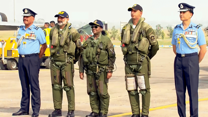 Droupadi murmu rafale sortie In this screenshot from a video posted on Oct. 29, 2025, President Droupadi Murmu with Chief of the Air Staff Air Chief Marshal AP Singh, second from left, and others before she takes a sortie in Rafale fighter jet, at Air Force Station in Haryana's Ambala | PTI