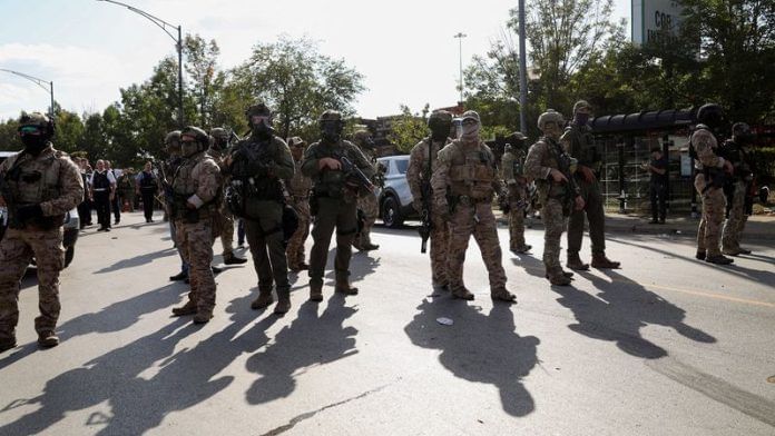 Law enforcement officers operate during a standoff with U.S. Immigration and Customs Enforcement (ICE) and federal officers in the Little Village neighbourhood of Chicago, Illinois on 4 October 2025. | File Photo | Jim Vondruska | Reuters