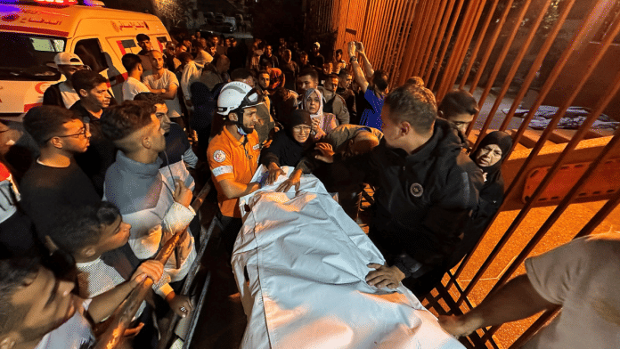 Israel strike on Gaza Palestinians react next to the body of a man, who according to medics was killed in an Israeli strike earlier today, at Nasser Hospital in Khan Younis, southern Gaza Strip, October 28, 2025 | Reuters