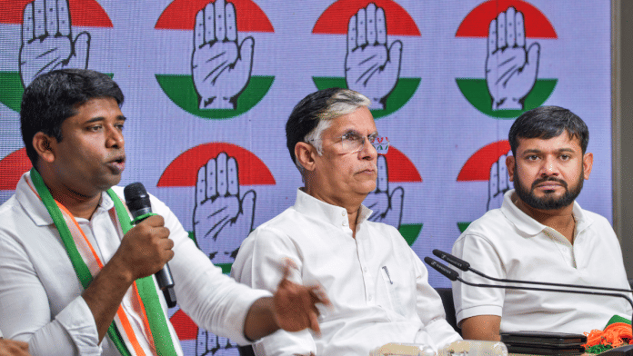 Former IAS officer Kannan Gopinathan speaks after joining Congress in New Delhi on Monday. Congress spokesperson Pawan Khera and AICC in-charge of NSUI Kanhaiya Kumar are seated next to him | PTI