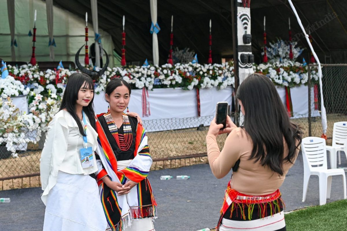 Youngsters taking pictures near the stage after the reception | ThePrint/Suraj Singh Bisht