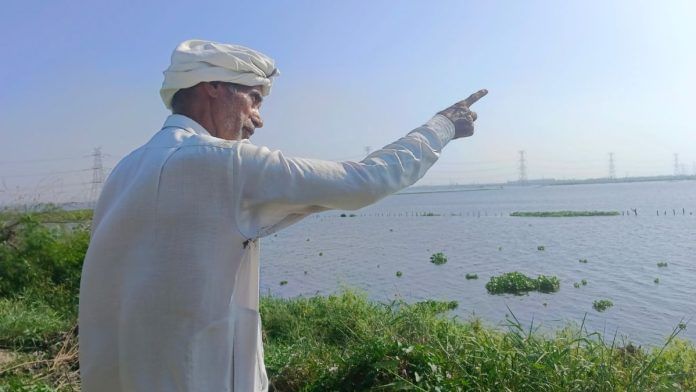 Sixty-three-year-old Omprakash owns four acres of land, which are submerged in the water from the Najafgarh drain / Almina Khatoon