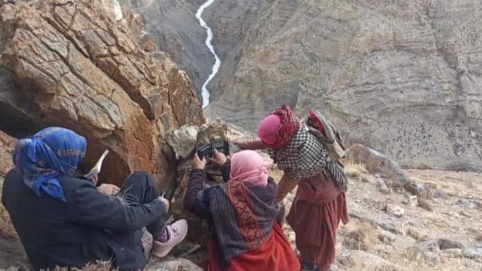 feature image - 2025-10-29T123803.771 Women from Kibber village set up a camera trap on a steep slope in Spiti Valley during the state-wide snow leopard survey. Image courtesy of Wildlife wing- Himachal Pradesh Forest Department and the Nature Conservation Foundation | Mongabay India