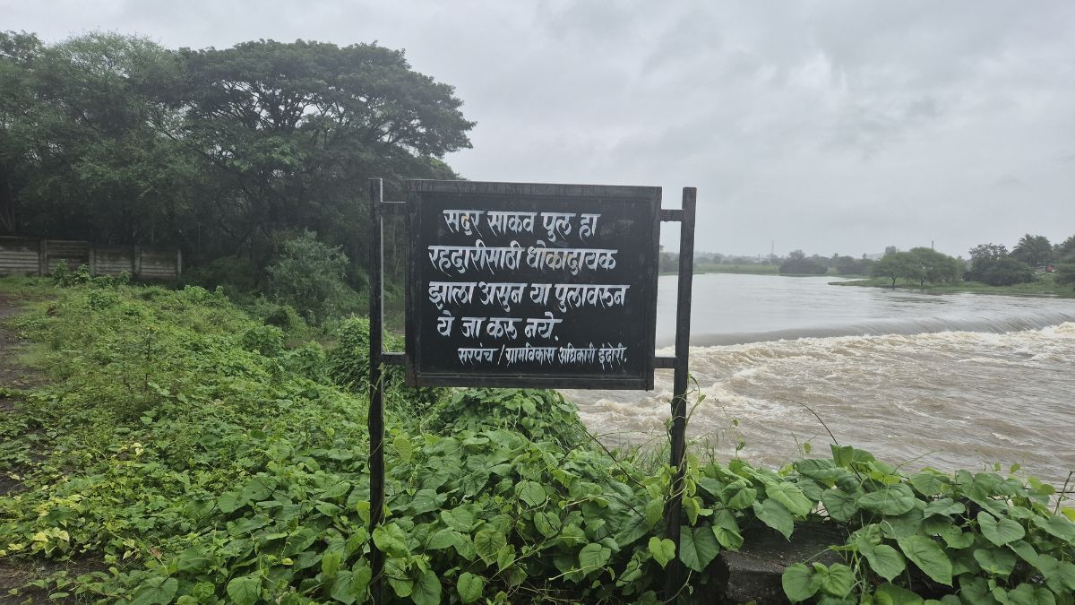 Signage had come up 2 years ago near the pedestrian bridge on Indrayani river, advising people against using the bridge | Photo: Shubhangi Misra, ThePrint