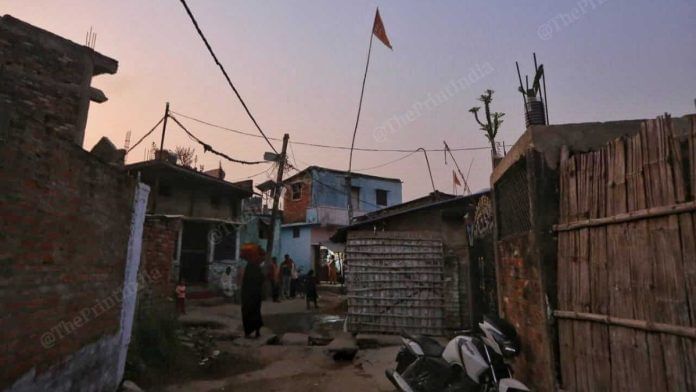 Saffron flag bearing Shiva’s image atop a Hindu temple at Sobhan village in Begusarai | ThePrint/Praveen Jain