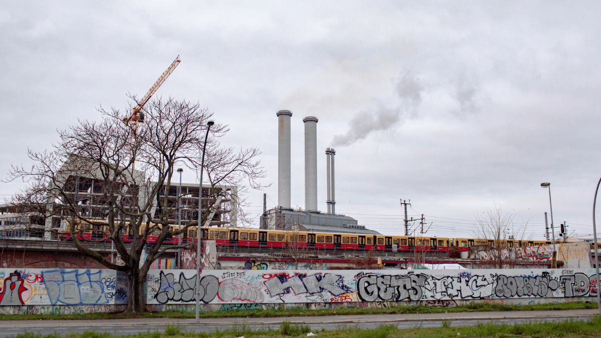 A train passes the Mitte Combined Heat and Power natural gas power plant in Berlin on Jan. 1 | Bloomberg