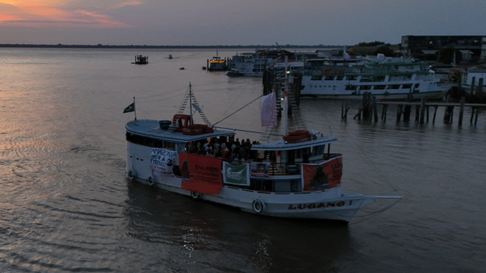 A drone view shows a boat, carrying Indigenous representatives from across Latin America, arriving in Belem, ahead of the UN Climate Change Conference (COP30), in Brazil, November 9, 2025 | Reuters