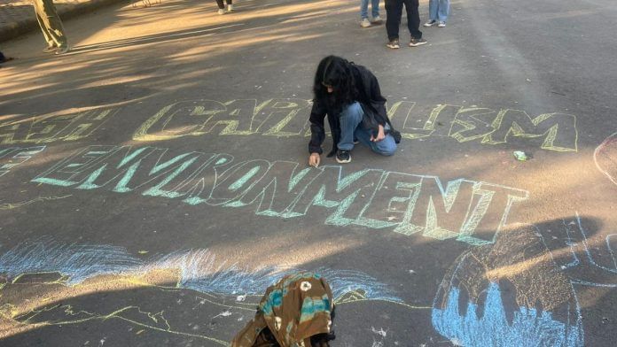 A group of protestors wrote their slogans down on the street with coloured chalk. | Udit Hinduja | ThePrint