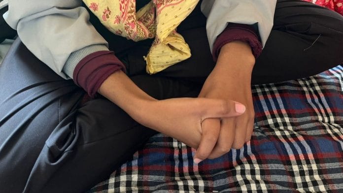 Mukesh’s daughter Jyoti Jangid sits on the bed of their house. Photo: Nootan Sharma | ThePrint