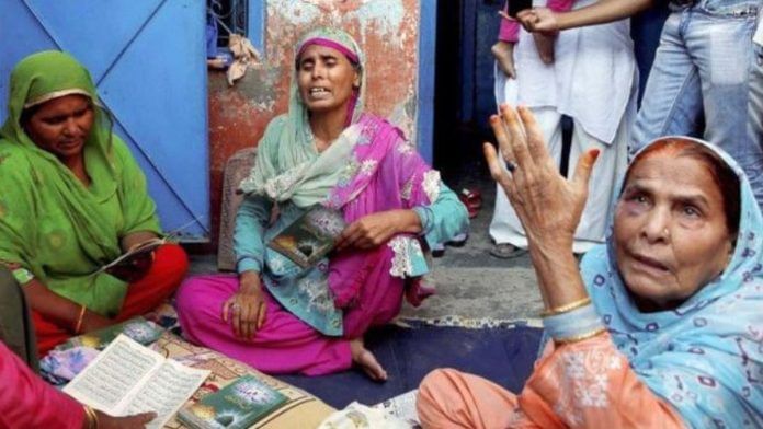 Relatives mourn the death of Mohammad Akhlaq at his home. | PTI
