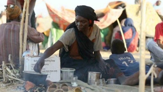 A displaced Sudan woman and others who fled Al-Fashir, which was taken by the paramilitary Rapid Support Forces, take shelter in makeshift tents | (c) Copyright Thomson Reuters 2025