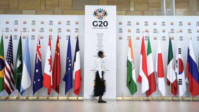 A woman walks at the Cape Town International Convention Centre during the G20 Finance Ministers meeting in Cape Town, South Africa on 24 February 2025. | Nic Bothma | Reuters