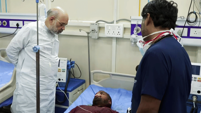 Home Minister Amit Shah interacts with Shiva Jaiswal at LNJP Hospital in New Delhi Monday | ANI