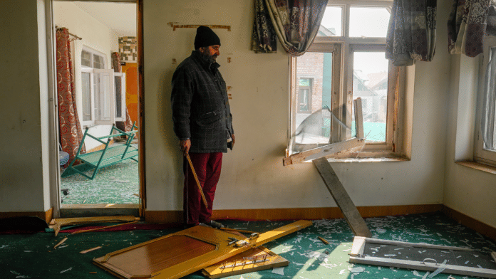 A man takes stock of his damaged house in the aftermath of a blast at the Nowgam police station, on the outskirts of Srinagar | PTI