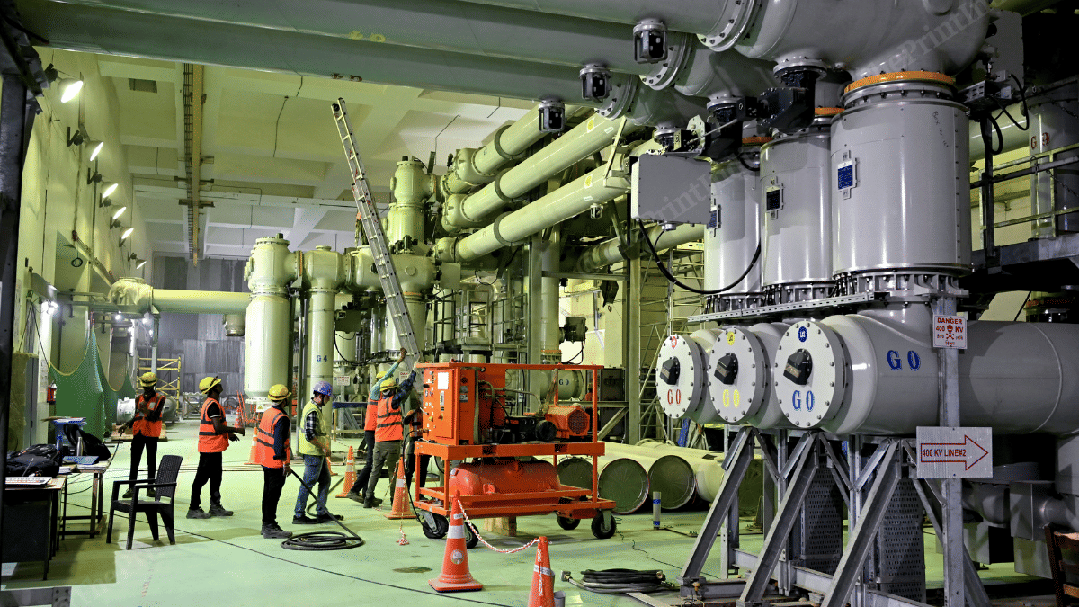 Workers near the giant machines of the Subansiri Lower Hydroelectric Project | Suraj Singh Bisht | ThePrint