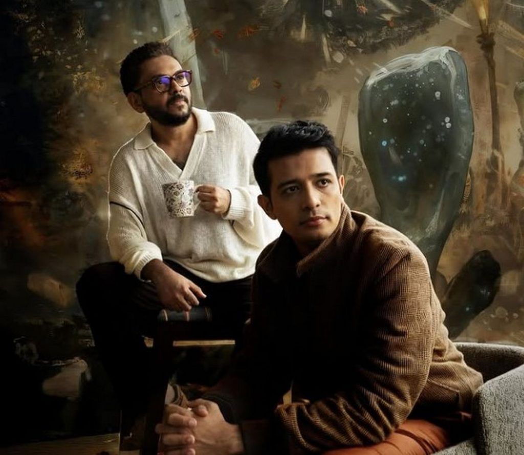 Anand Gandhi (left) and Zain Memon (right), with concept art from the MAYA Universe in the backdrop