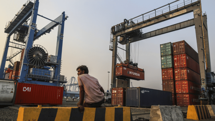 Gantry cranes move shipping containers at the Jawaharlal Nehru Port in Navi Mumbai, Maharashtra, India | Photographer: Dhiraj Singh/Bloomberg