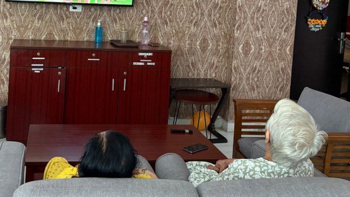 Residents watching a cartoon in the living room of Frida Epoch Elder Care | Sakshi Mehra