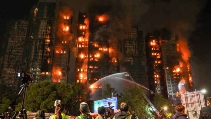 Firefighters tackle a fire engulfing residential buildings at Wang Fuk Court in the Tai Po district of Hong Kong on Wednesday, Nov. 26, 2025 | Bloomberg
