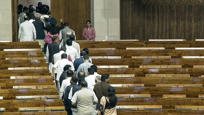 Representational | File photo of opposition Lok Sabha MPs staging a walkout | ANI
