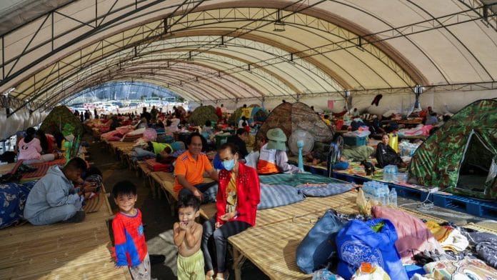 People rest at a shelter following fresh military clashes between Thailand and Cambodia along parts of their disputed border, in Buriram province, Thailand, Monday | Photo: Reuters