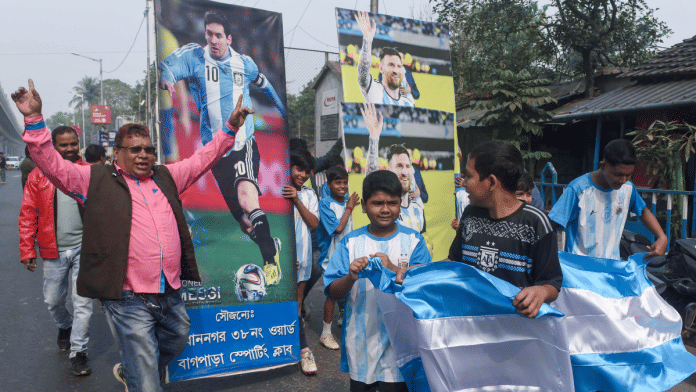 People carry posters to celebrate Lionel Messi's India Tour 2025, in Kolkata on Friday, 12 Dec | ANI