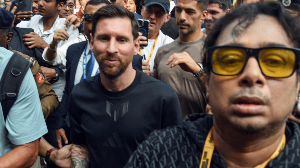 Argentine football star Lionel Messi with main organiser Satadru Dutta at Salt Lake Stadium during his G.O.A.T India Tour 2025. | ANI