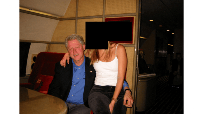 Former U.S. President Bill Clinton and a woman are seen in this image from the estate of late financier and convicted sex offender Jeffrey Epstein, released by the Department of Justice in Washington, D.C., U.S., on December 19, 2025 | Reuters