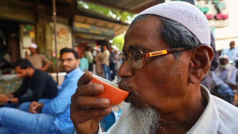 An elderly man sips tea at a tea stall in Malegaon. Manisha Mondal | ThePrint