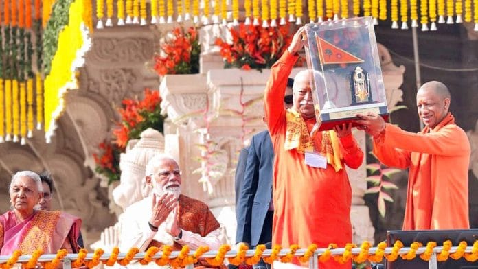 Uttar Pradesh Chief Minister Yogi Adityanath felicitate Rashtriya Swayamsevak Sangh (RSS) Chief Mohan Bhagwat during the Dhwajarohan Utsav at Shri Ram Janmabhoomi Mandir, in Ayodhya on Tuesday. (@myogiadityanath X/ANI Photo)