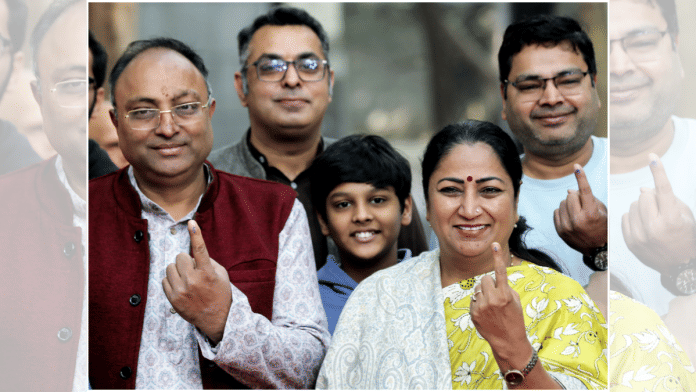Delhi Chief Minister Rekha Gupta, along with her family, poses for a picture showing their ink-marked fingers after casting their vote for Delhi Municipal Corporation Bypolls, in New Delhi on Sunday, 30 November | File Photo | ANI