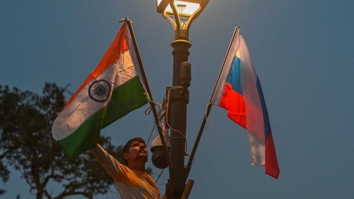 National flags of India and Russia being arranged on light poles along Kartavya Path in New Delhi Wednesday, ahead of Russian President Vladimir Putin's India visit | ThePrint photo by Suraj Singh Bisht