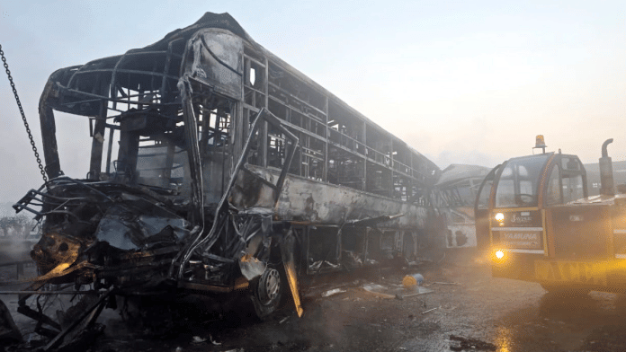 Cranes clear the charred remains of buses after a fog-hit pile-up involving several buses and cars triggered fires on the Yamuna Expressway, in Mathura, Tuesday, Dec. 16, 2025 | PTI